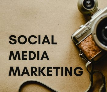 pexels-photo-6956300-6956300 Close-up of a vintage camera next to a social media marketing concept text on a brown background.